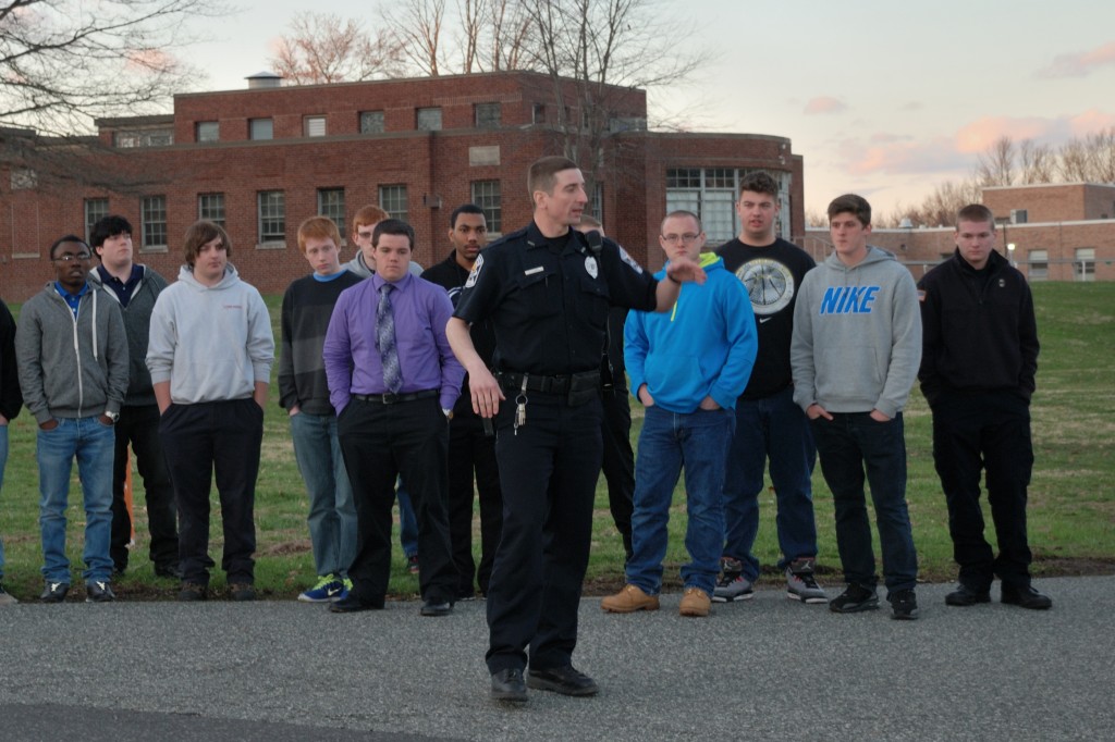 Norristown Police Department Officer Brian Kozera explain to members of the GNPAL Law Enforcement Post the proper techniques for directing traffic.