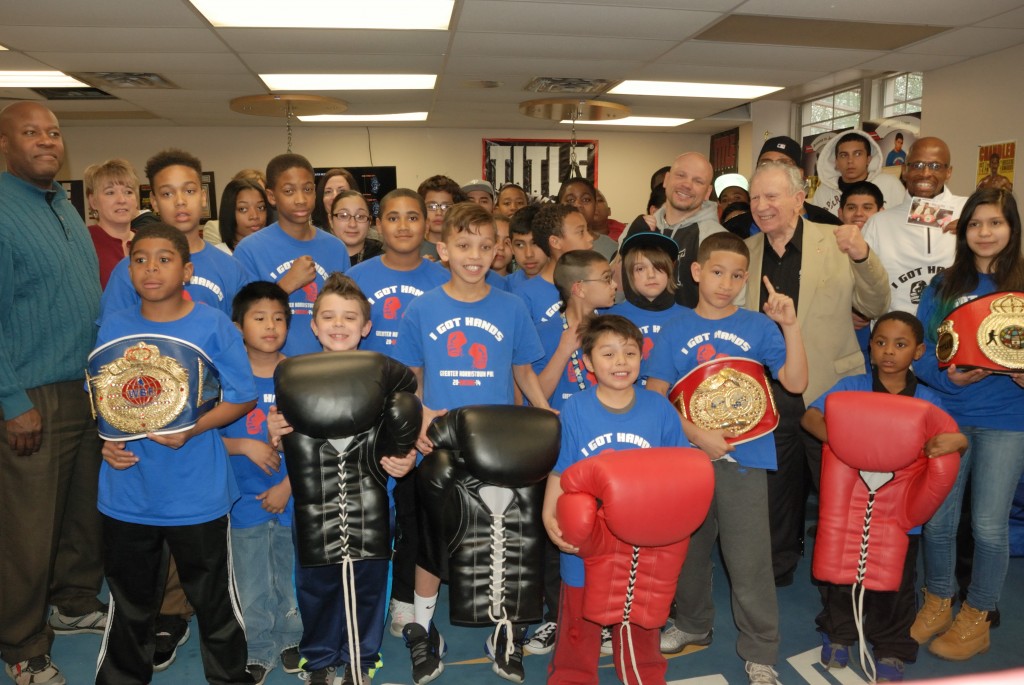Norristown Ambassador Hank Cisco and middleweight boxer Harry Yorgey pose with members of the GNPAL boxing program, GNPAL Director of Operations and guests from the Franklin Mint Credit Union at the kick-off of the new Youth Advocacy Prevention and Intervention Program (Y.A.P.I.P.)