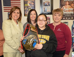 Franklin Mint Credit Union employees Karen Hasset, Carol Amplo, and Denice Margurger pose with Francheska Medina who was awarded the Education belt for the "I Got Hands" mentoring program.