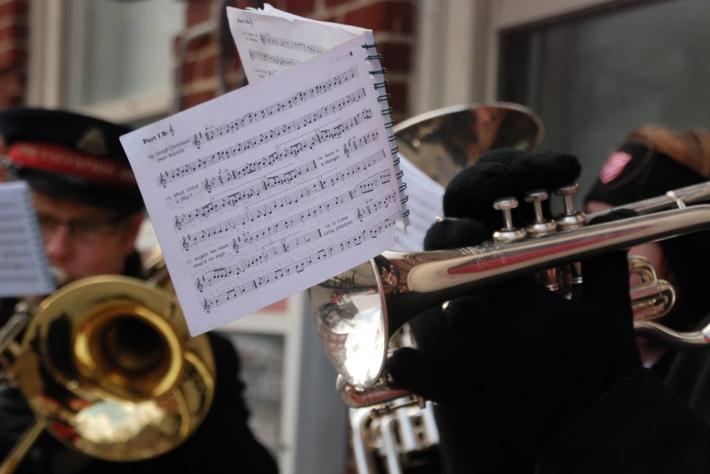 Christmas carols were being played outside the Salvation Army building as the truck was being unloaded.